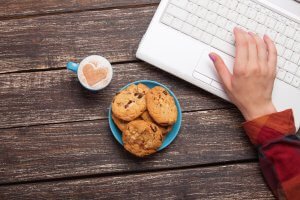 cookie and women hand with notebook